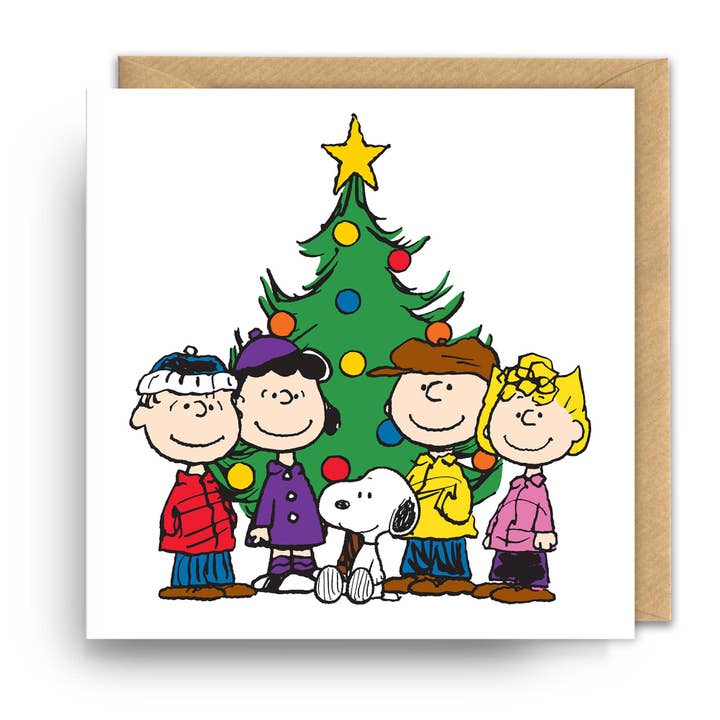 Snoopy and Peanuts friends Christmas card gathered around a Christmas tree