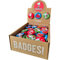 Snoopy Christmas badge display box containing assorted festive pin badges