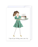 Illustration from the “Birthday Wishes Cake” card: a girl wearing a green patterned dress holds a birthday cake topped with four lit candles. The text below her reads, “I hope all your birthday wishes come true!” This charming card is blank inside and proudly made in NZ.