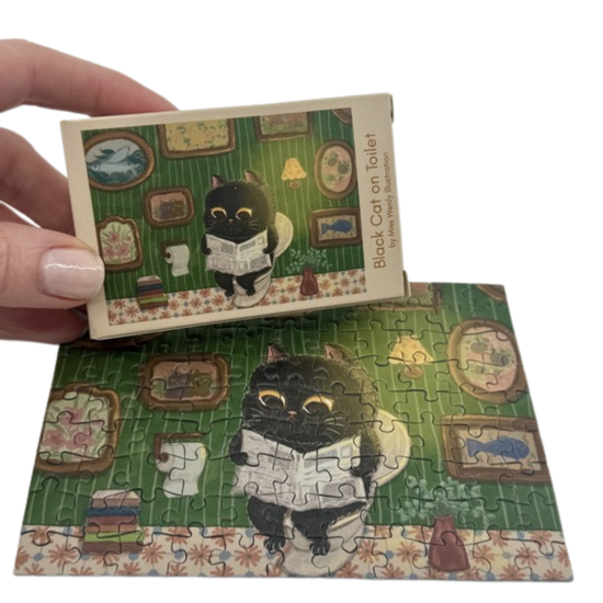 The Puzzle Collab Black Cat on The Toilet 99 Piece Micro Puzzle
