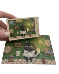 The Puzzle Collab Black Cat on The Toilet 99 Piece Micro Puzzle