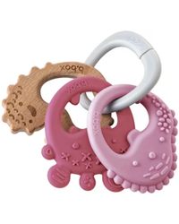 Three b.box baby teething toys arranged together on a white background: a natural wood bear-shaped teether, a pink silicone bear teether, a pink silicone moon teether, and a white carabiner ring.