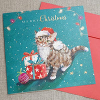 Cat With Gifts Christmas card with tabby cat in Santa hat beside wrapped presents
