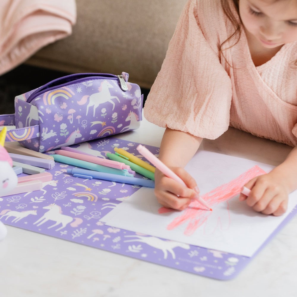 Unicorn Dreams placemat protecting a table during colouring