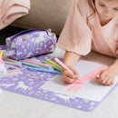 Unicorn Dreams placemat protecting a table during colouring