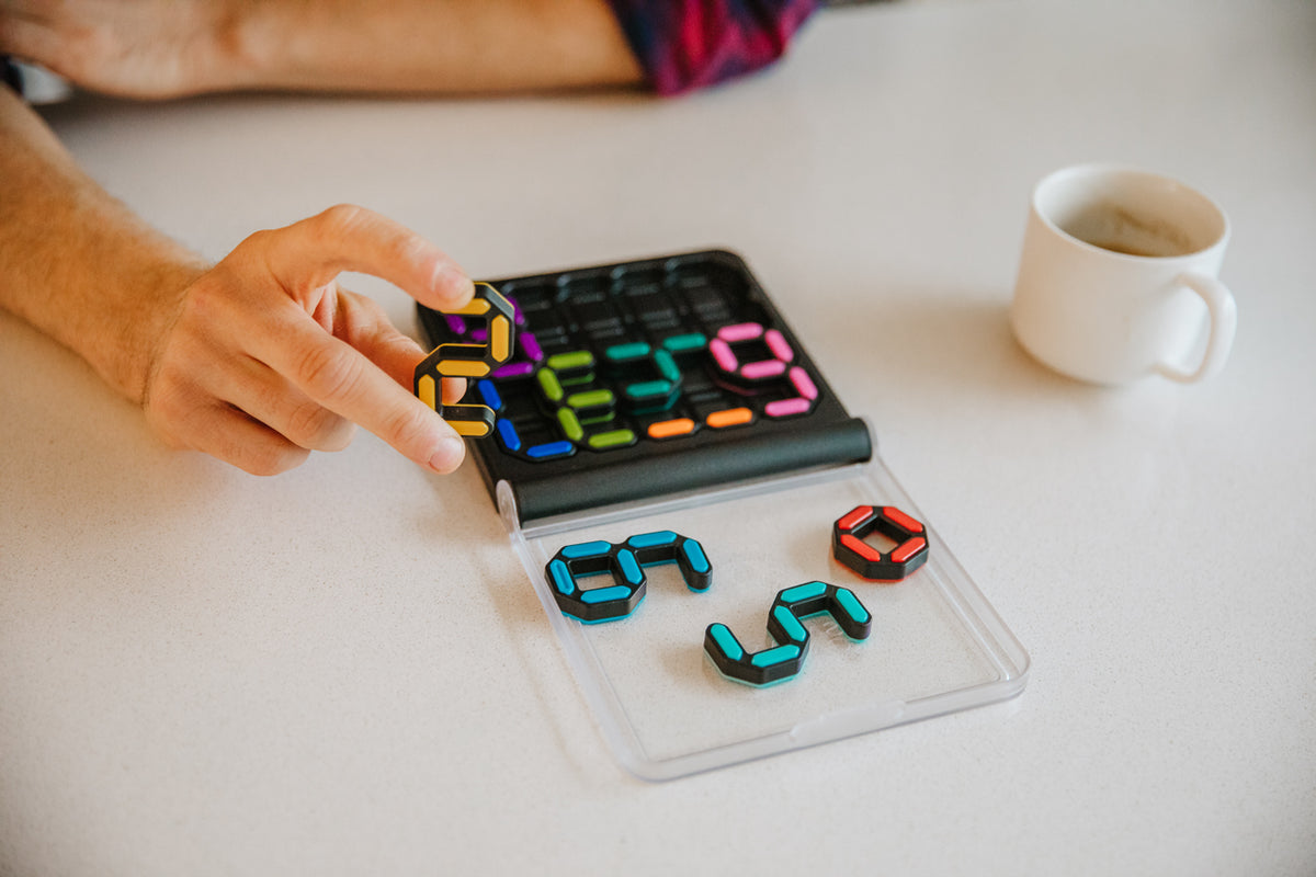 SmartGames IQ Digits puzzle shown in use